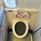 Illustration for article titled A New Design Promises to Quiet the Terrifying Roar of Flushing an Airplane Toilet